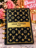 Black and gold patterned notebook with gold-tone rings