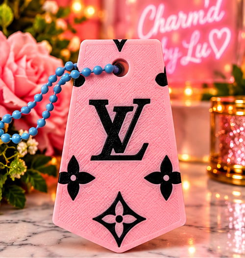 Pink decorative 3D-printed keychain with blue ball chain